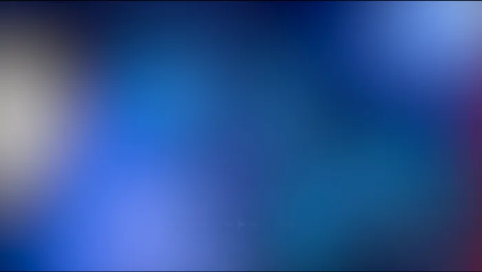 Blurred still of a paused video player showing a dark blue gradient, faint playback controls visible near the bottom.